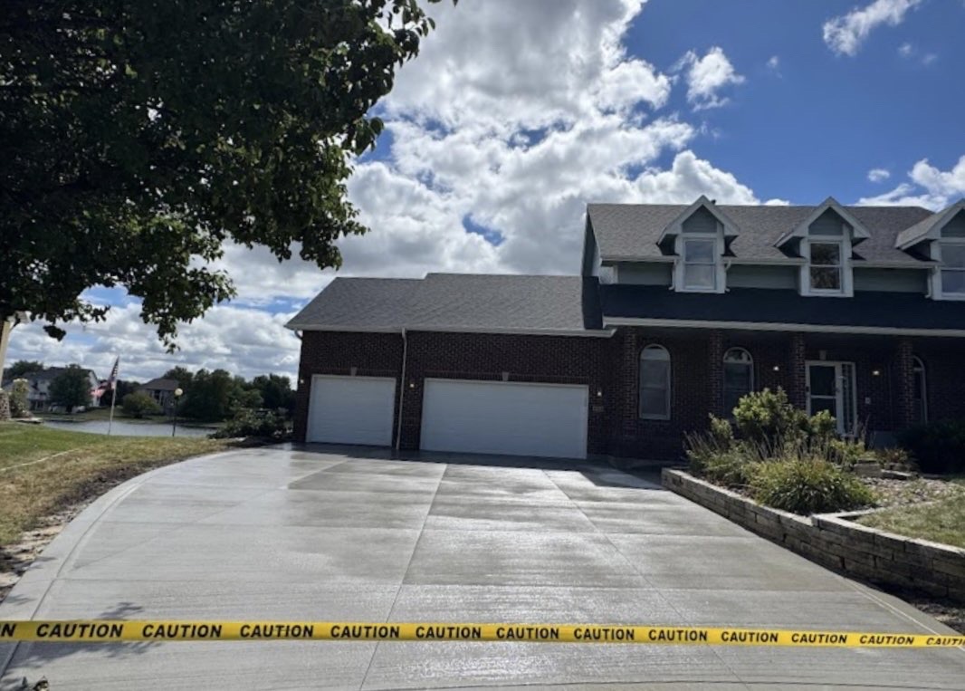New concrete driveway at brick house in Des Moines