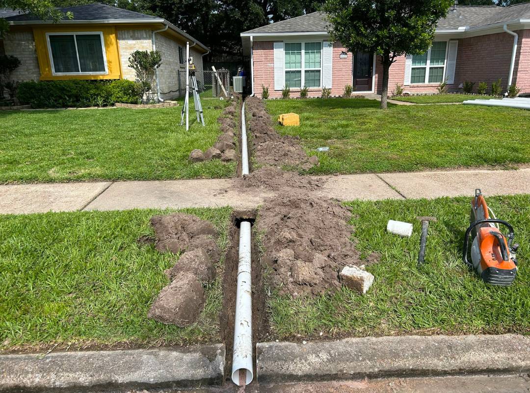 Underground drainage pipe installation in Des Moines yard