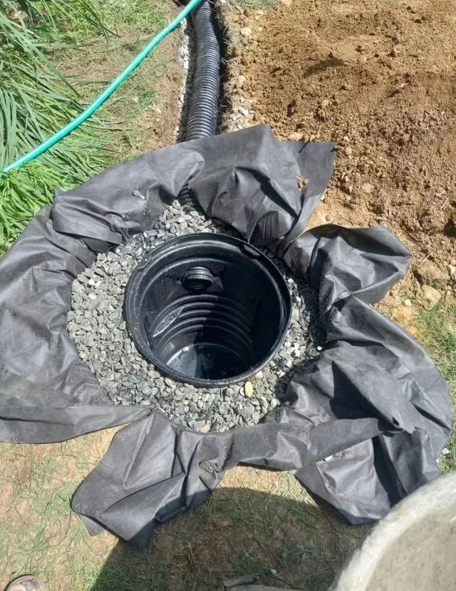 Catch basin installation with gravel surround