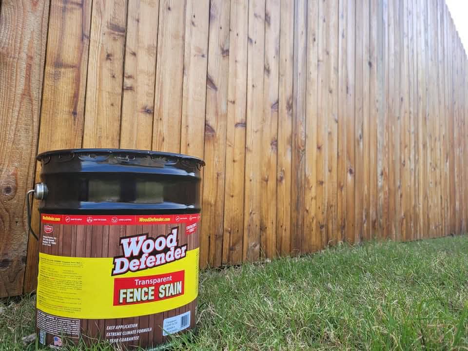Wood Defender fence stain application on cedar fence in Des Moines