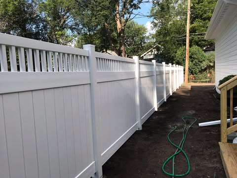 White vinyl fence with decorative top rail in Des Moines