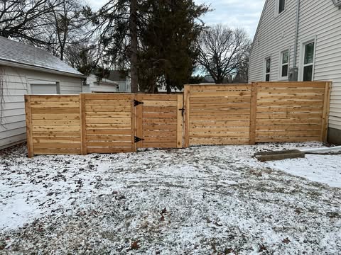 Horizontal cedar privacy fence with gate in Des Moines